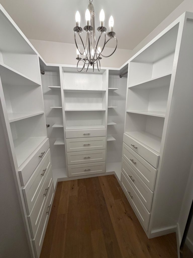 Custom bedroom closet remodeling with built-in storage in a Massachusetts home