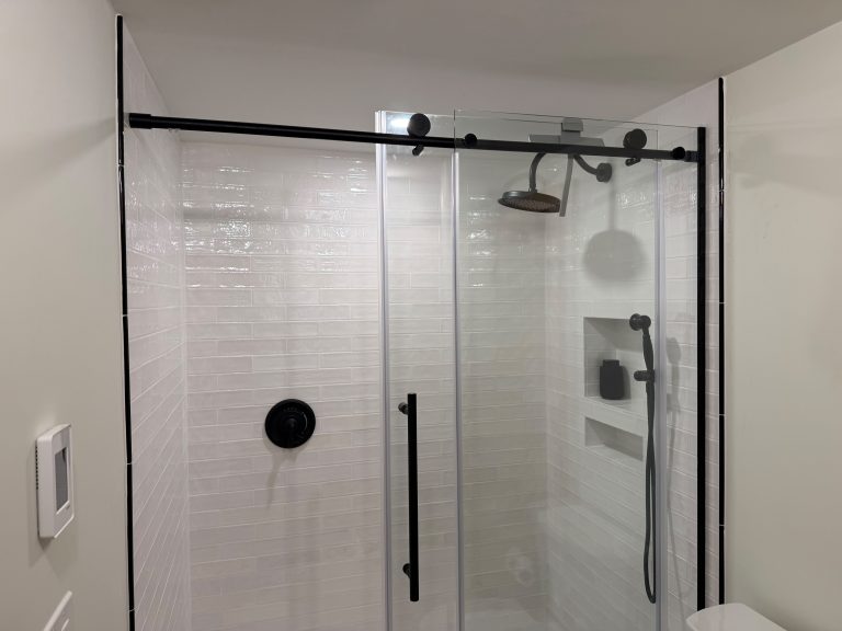 Custom bathroom remodel with large format tile shower and glass enclosure in Massachusetts