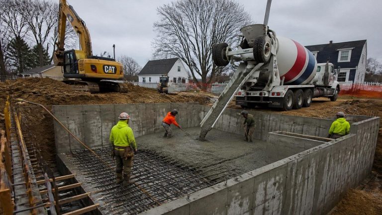 Concrete foundation construction work on residential home in Massachusetts