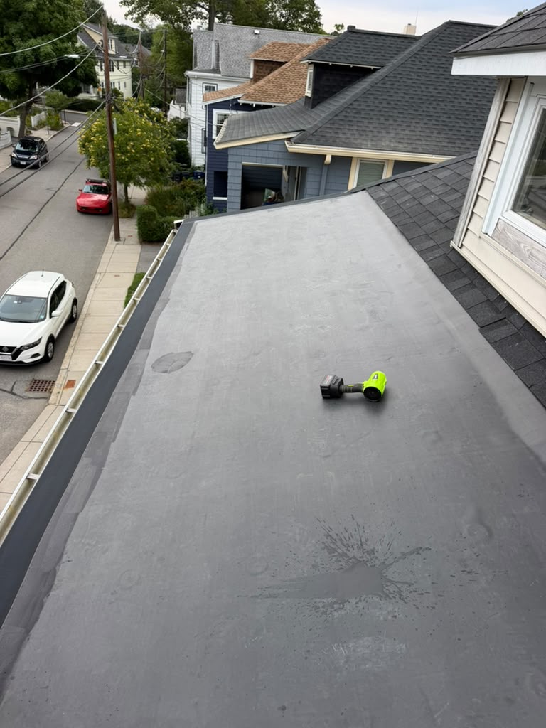 Completed flat roof replacement project by Ronie Construction in Massachusetts