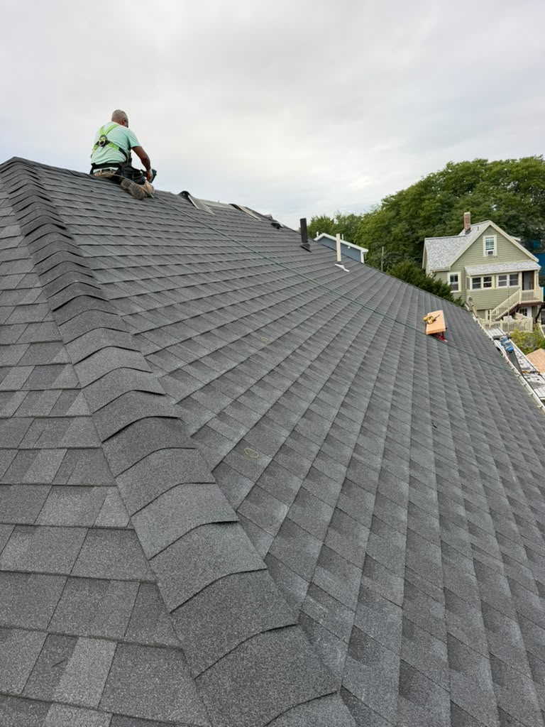 Completed asphalt shingle roof replacement by Ronie Construction in Massachusetts