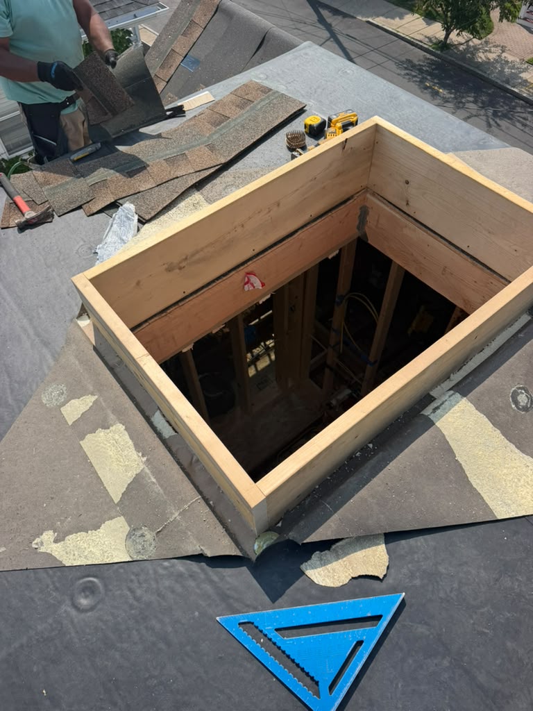 Structural roof framing during a Ronie Construction project in Massachusetts