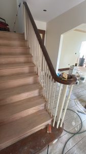 Interior staircase renovation in progress by Ronie Construction in Massachusetts